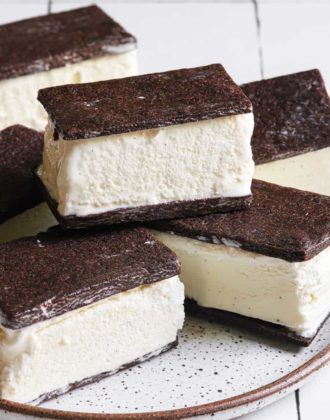 A close up shot of ice cream sandwiches on a plate.