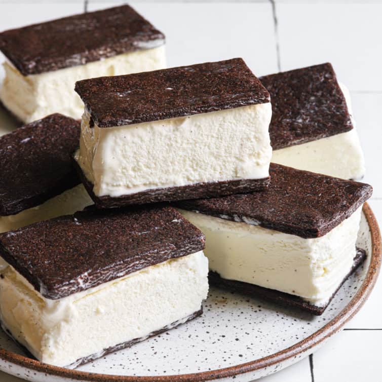 A close up shot of ice cream sandwiches on a plate.