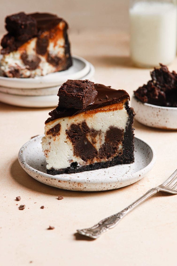 side view of this brownie cheesecake recipe with another slice in the background