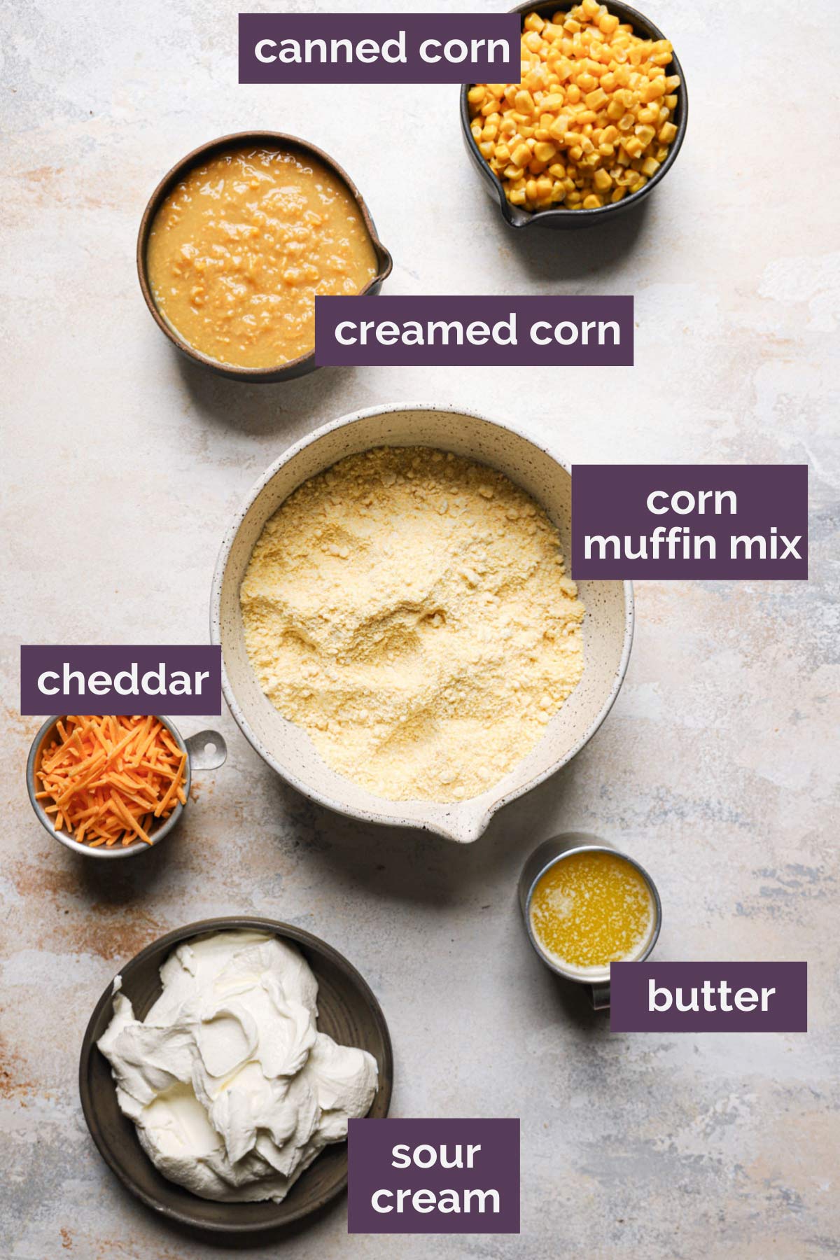 an overhead view of the labeled ingredients needed to make this cheesy creamed corn casserole recipe