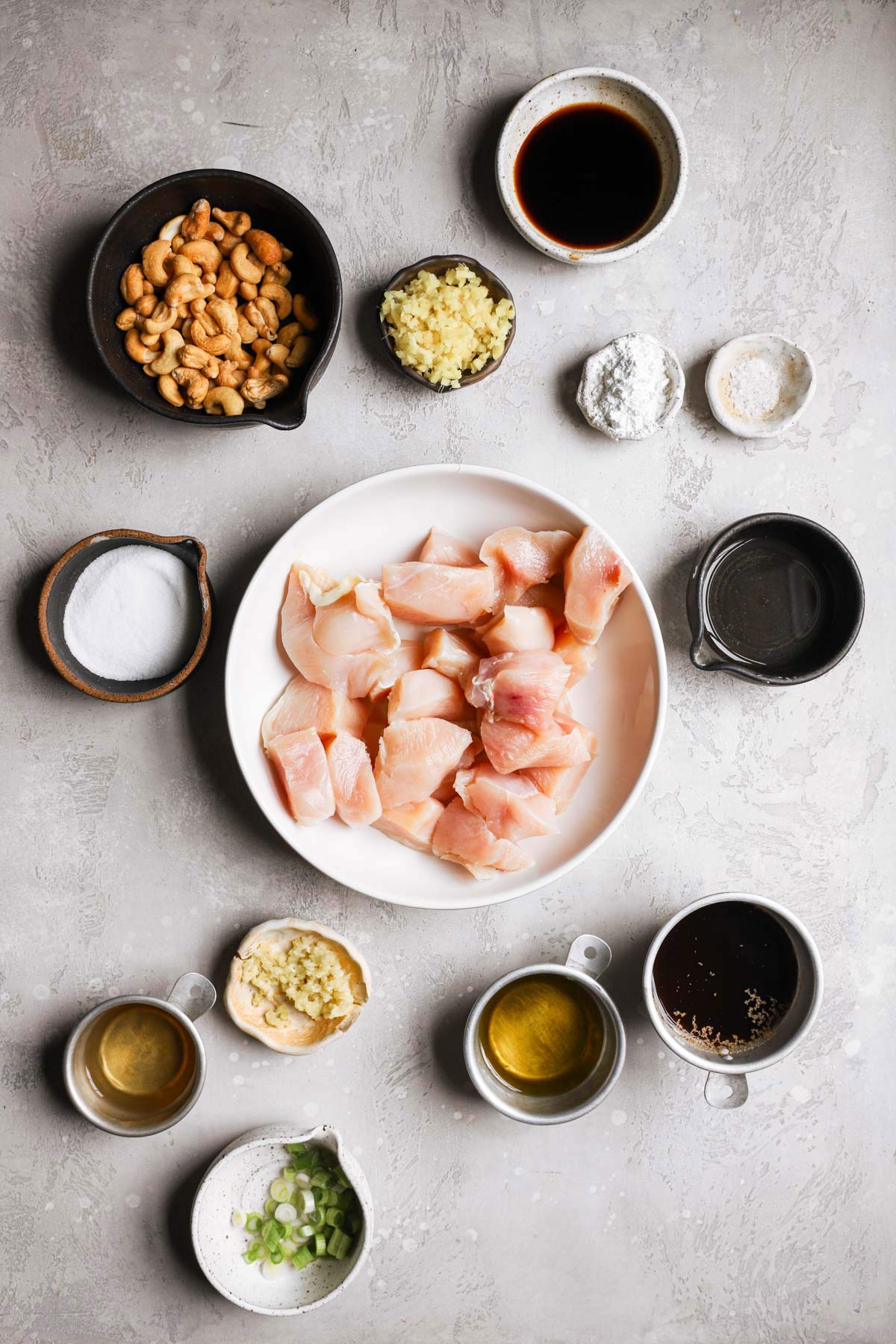 Ingredients for chicken with cashew nuts prepped on a counter.