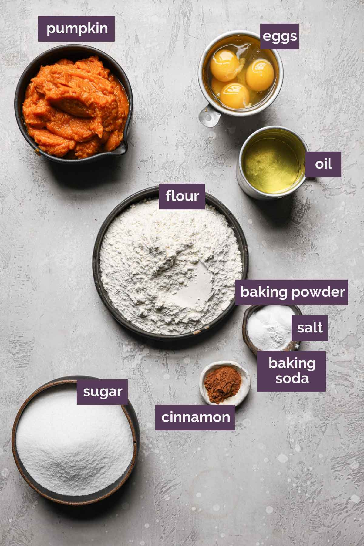 Ingredients for pumpkin bars prepped in bowls and labeled.