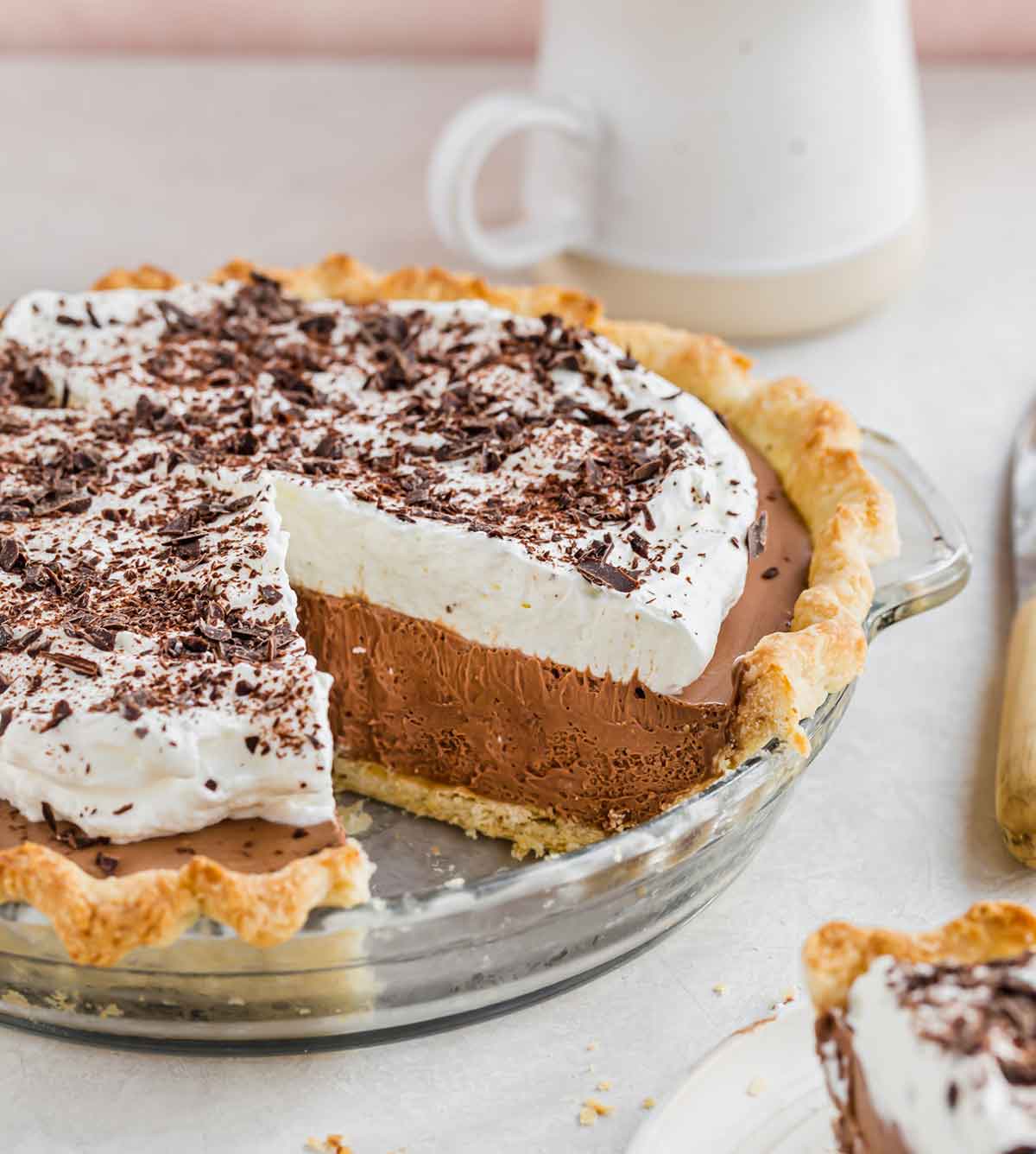 Photo of French silk pie with one slices removed from the pan.