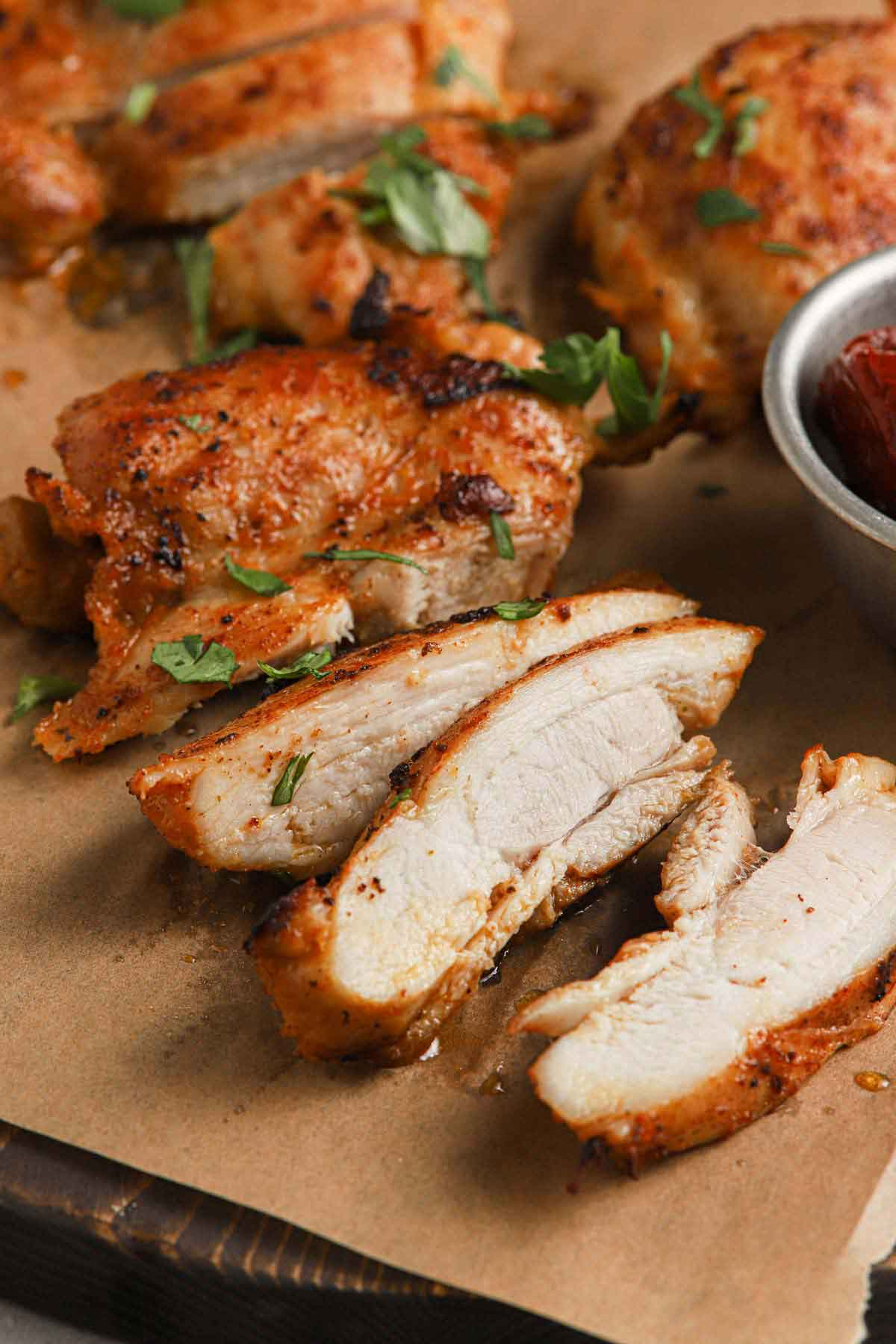 Sliced chicken on a cutting board.