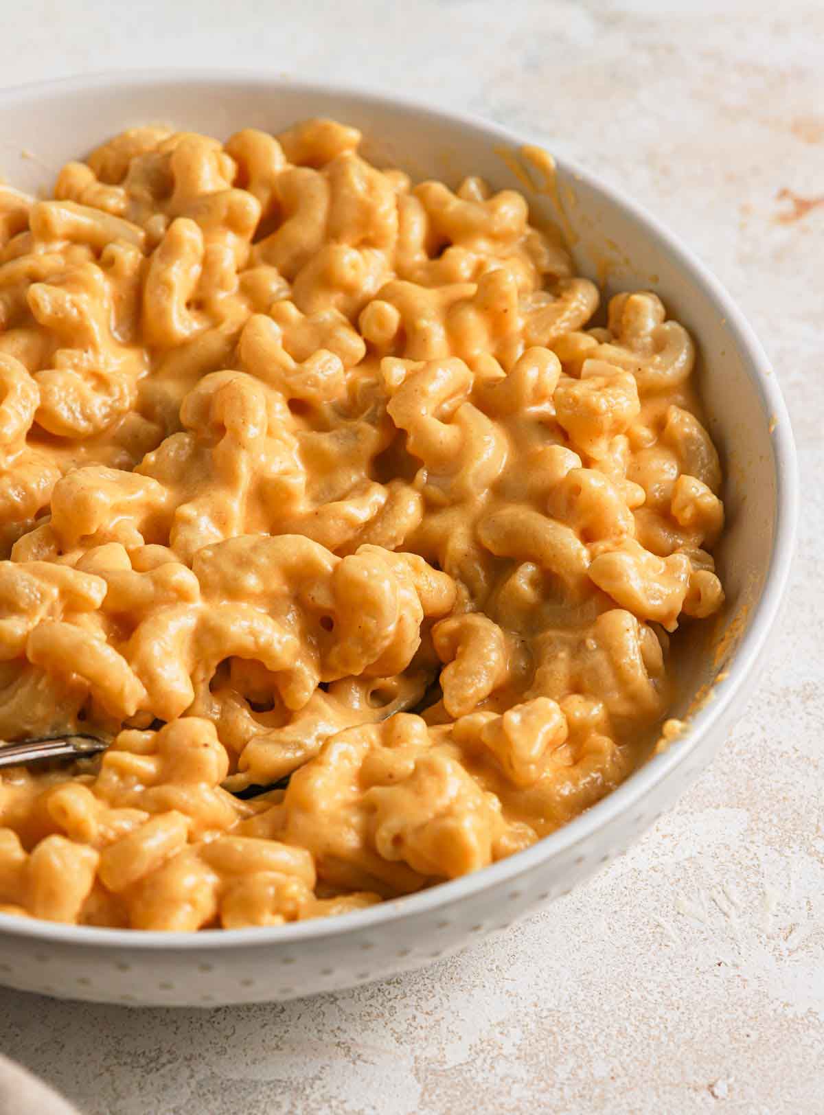 Close up photo of a bowl of homemade mac and cheese.