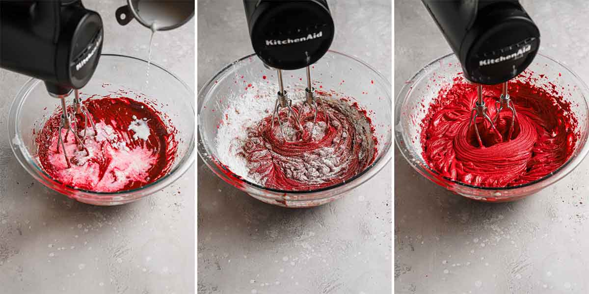 Red velvet cake batter being mixed together in a glass bowl using a hand mixer.