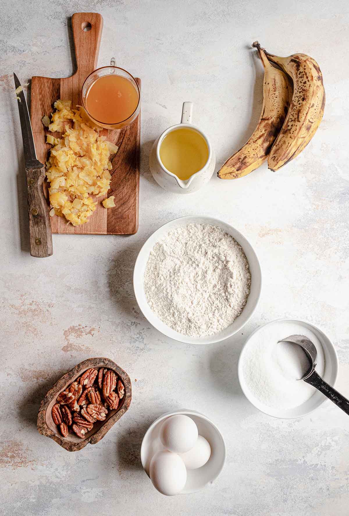 Ingredients for hummingbird cake prepped on a counter.