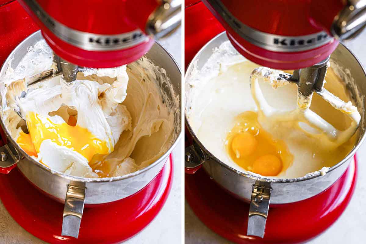 Eggs being mixed into cheesecake batter in the bowl of a stand mixer.
